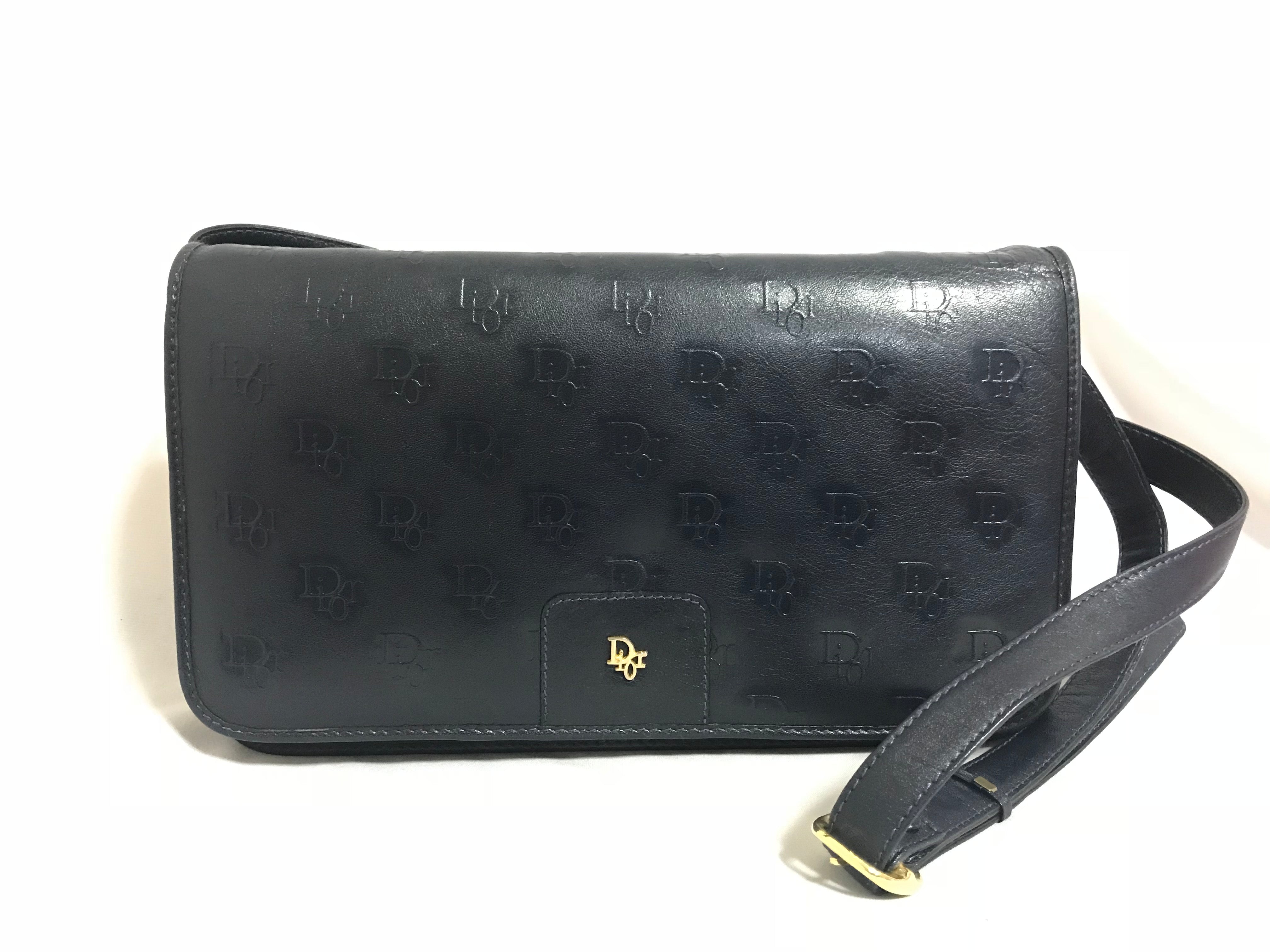 MINT. Vintage Christian Dior navy leather clutch purse, shoulder bag with golden Dior logo motif.