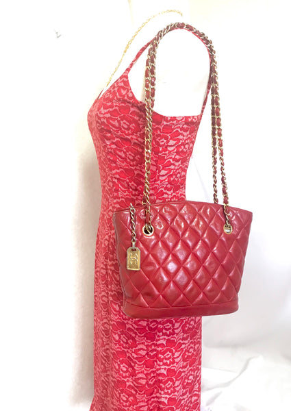 Vintage CHANEL red lamb leather shoulder bag with golden CC button motifs  at flap. Rare purse.