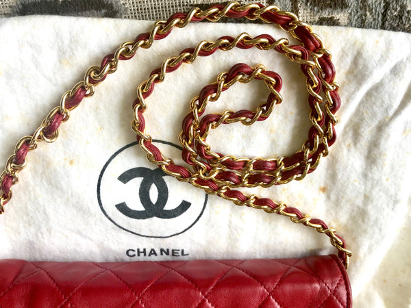 Vintage CHANEL red lamb leather shoulder bag with golden CC button