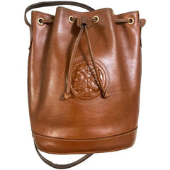 Vintage FENDI brown leather hobo bucket, shoulder bag with drawstring and iconic Janus medallion embossed motif at front. Unisex. Rare bag.