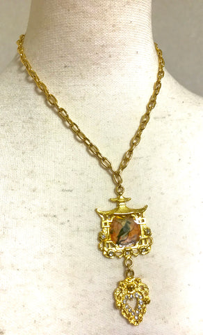 MINT. Vintage Christian Lacroix rare golden chain necklace with crystal heart and Chinese influenced bird resin and house pendant top.