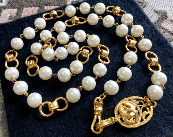 Sold at Auction: 8 mm round cream color faux pearl gold tone clasp knotted  necklace, 24 1/2 inches, Japan