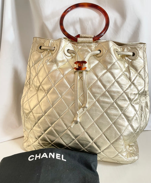 Chanel Small Coral Lambskin Surpiqué Drawstring Bucket Bag - Ann's