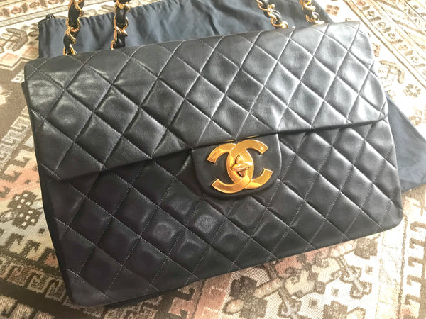Vintage CHANEL black lamb leather large classic bag with double
