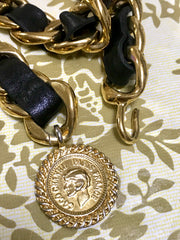 1980s Vintage CHANEL black leather thick chain belt with golden CC and mademoiselle charm. Nice and heavy single layer belt from CHANEL.