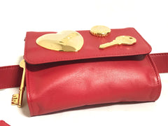 Vintage MOSCHINO red leather waist purse, fanny pack, clutch bag with large golden heart, key motifs, and can budge motif. R0410118