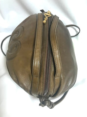 Vintage Moschino soft brown leather drum shape shoulder bag with iconic Question marks. Moschino by Redwall. Made in Italy.