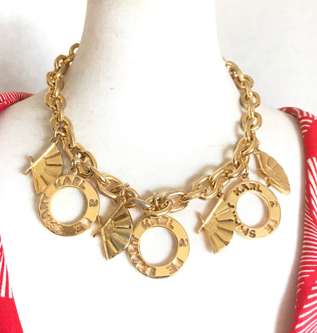 Vintage Karl Lagerfeld golden chain statement necklace with logo and fan dangle charms. Gorgeous rare jewelry piece back in the era.