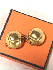 Vintage HERMES gold tone round earrings with knot button design. Fabulous jewelry piece back in the old era.