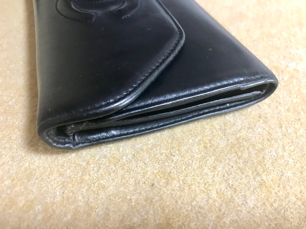 Vintage CHANEL black leather wallet with large CC stitch mark. Rare wallet  from Chanel in 90’s.