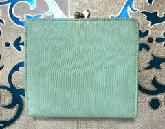 Vintage Salvatore Ferragamo blue lizard embossed leather wallet with gold tone vara motif.
