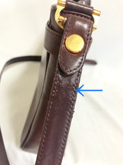 Vintage Cartier kelly style wine leather shoulder bag with a decorative built-in belt.  les must de cartier collection.