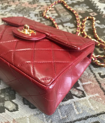 Vintage CHANEL deep red lambskin mini 2.55 bag with golden CC and chain strap. Classic Chanel red bag back in the era.
