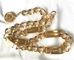 Vintage CHANEL golden thick chain belt with logo engraved bar motifs and a round charm to the end. Must have gorgeous accessory.