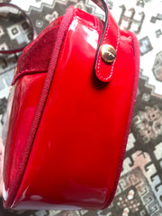 Vintage Salvatore Ferragamo vara collection patent enamel lipstick red shoulder bag with gold tone bow charm. Classic Ferragamo purse.