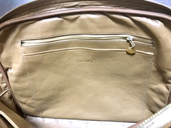 80's Vintage CHANEL brown lambskin large classic bag with double golden chain strap and a CC pull charm.