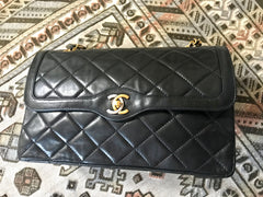 OFV 20210526 Vintage Chanel black lamb 2.55 double flap chain shoulder bag with gold and silver CC motif. Paris limited edition. Mid to large size