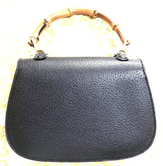 Vintage Gucci genuine pigskin black handbag purse with bamboo handle. Classic purse from collection.