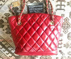 Vintage CHANEL lipstick red quilted lambskin leather trapezoid shape tote bag with a gold CC plate and chains.