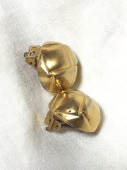 Vintage HERMES gold tone round earrings with knot button design. Fabulous jewelry piece back in the old era.