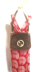 Vintage Gucci brown leather micro GG print shoulder bag with iconic golden large round GG motif. Rare masterpiece purse.