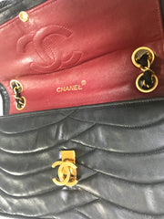 80's vintage Chanel black 2.55 shoulder bag with wavy stitches and rope strings and gold chain strap. Very rare piece from the era