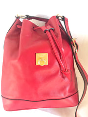 Vintage Celine red leather hobo bucket shoulder bag with a golden square logo motif and matching pouch. Classic drawstrings purse.