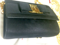 Vintage Salvatore Ferragamo black leather shoulder mini bag with golden chain and Vara bow motif. Clutch purse from Vara collection. R041011