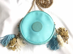 MINT. Vintage MCM blue monogram mini Suzy Wong pouch bag with golden chain and blue, gold, and white fringes. Michael Cromer. 0404041
