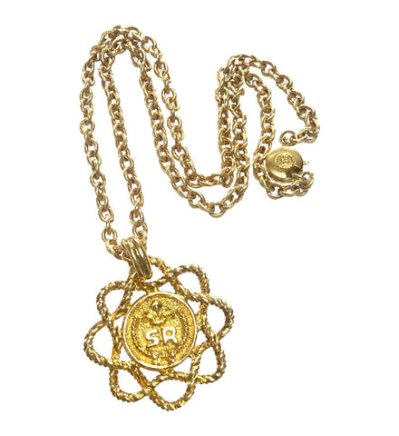 Vintage Sonia Rykiel long golden chain necklace with twisted flower and logo pendant top. Perfect vintage jewelry from SR.