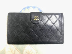 Vintage CHANEL black caviar leather wallet with stitches and gold tone CC motif. Perfect gift.