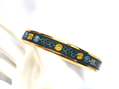 Ves. Vintage Hermes cloisonne enamel bangle with green, yellow, and blue. Charm and chain design. 050320r7