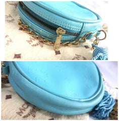 MINT. Vintage MCM blue monogram mini Suzy Wong pouch bag with golden chain and blue, gold, and white fringes. Michael Cromer. 0404041