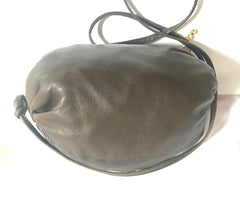 Vintage Moschino soft brown leather drum shape shoulder bag with iconic Question marks. Moschino by Redwall. Made in Italy.