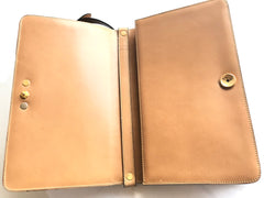 Vintage Christian Dior tanned brown leather shoulder clutch bag with golden CD motif.