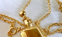 Vintage Celine gold tone long necklace with perfume bottle charm pendant top and blaison logo. Rare old jewelry piece. Must have.