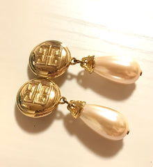 Vintage Givenchy golden round dangle earrings with teardrop faux pearl. Classic and beautiful jewelry piece.