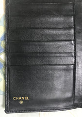 Vintage CHANEL black caviar leather wallet with stitches and gold tone CC motif. Perfect gift.