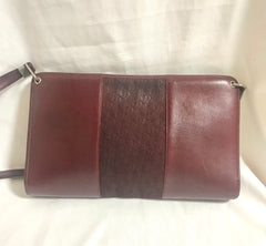 Vintage Christian Dior wine red leather clutch shoulder bag with engraved logo at center. Classic and beautiful purse from old dior era.