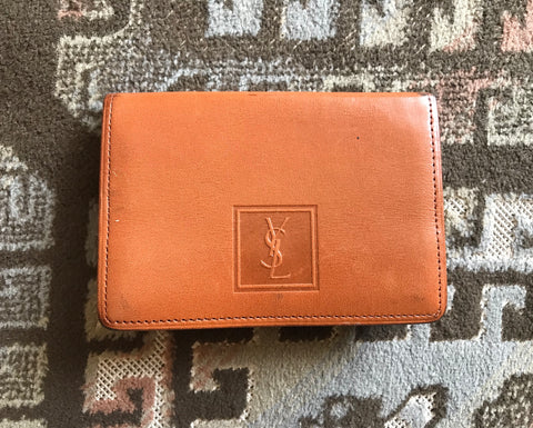 Vintage Yves Saint Laurent brown and khaki leather coin wallet with YSL logo embossed motif at front.