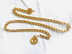 MINT. Vintage CHANEL flat golden chain belt with CC motif charms. Classic vintage accessory piece for daily use.