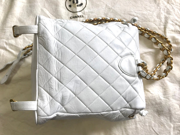 Vintage CHANEL quilted white lamb leather backpack with golden