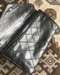 1980s. Vintage CHANEL black goatskin bill, card, checkbook long wallet pouch purse with  mini CC motif.  Classic unisex style.