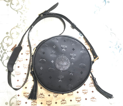 Vintage MCM black monogram round shape Suzy Wong shoulder bag with leather trimmings and fringes. Unisex and daily use. Germany made.