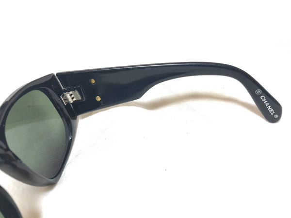 Vintage CHANEL black frame sunglasses with large CC motifs and