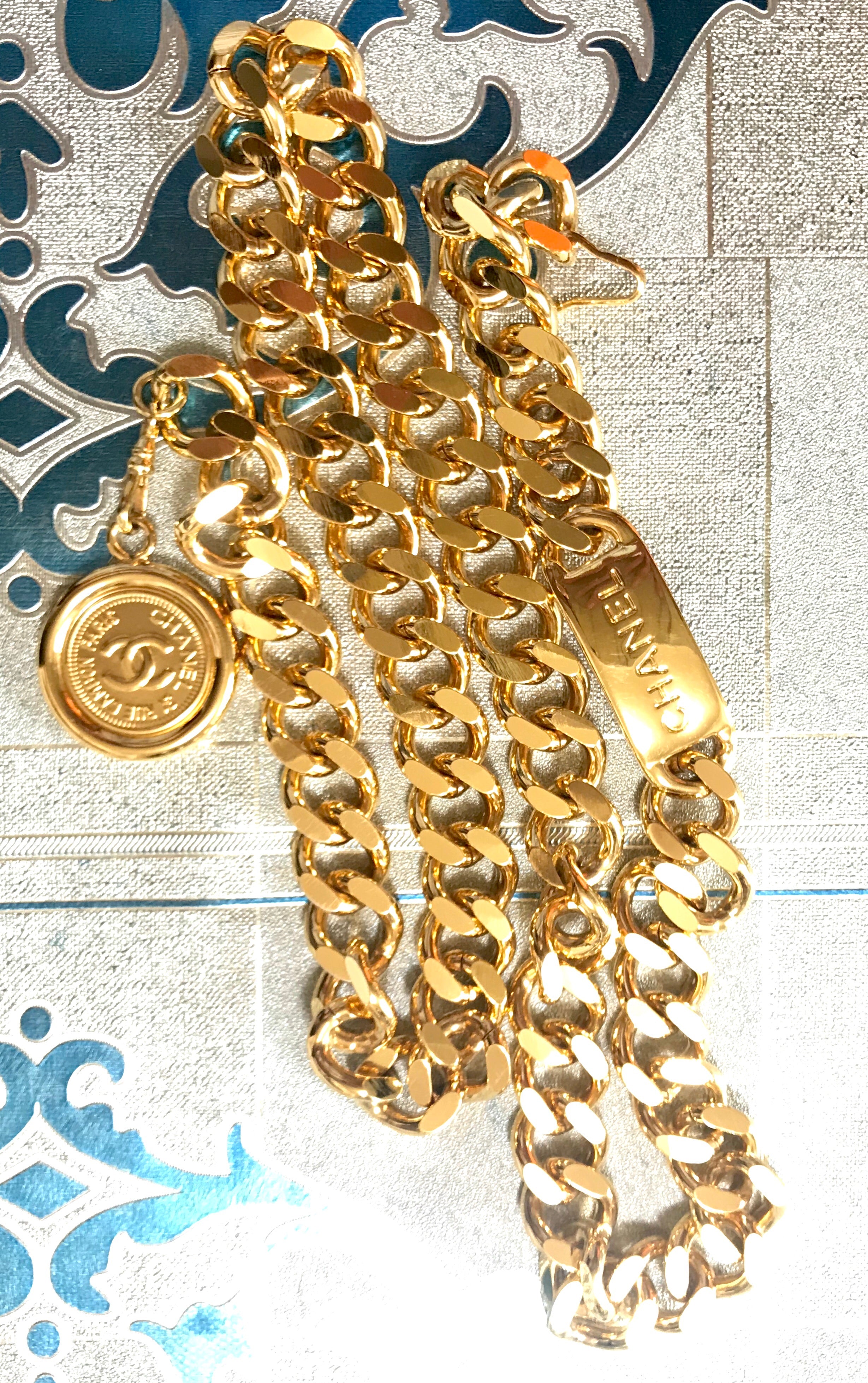 MINT. Vintage CHANEL golden thick chain belt with a CC charm and