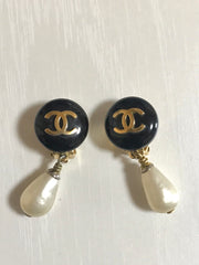 Vintage CHANEL teardrop white faux pearl earrings with black and golden CC mark on top. Chanel dangle earrings. Beautiful jewelry gift.