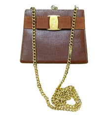 Vintage Salvatore Ferragamo brown lizard embossed leather golden chain clutch bag with vara gancini collection. Kiss lock closure purse.