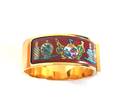Vintage Hermes cloisonne enamel golden click and clack Flacon bangle with wine red and colorful perfume bottle design. Great gift idea