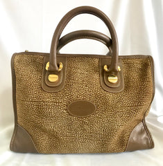 Vintage Borbonese by red wall, brown and beige leather classic bag with golden logo charm.  Unisex use. Masterpiece.